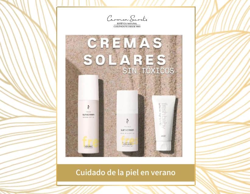 Cremas solares naturales Ringana sin tóxicos sobre fondo de arena